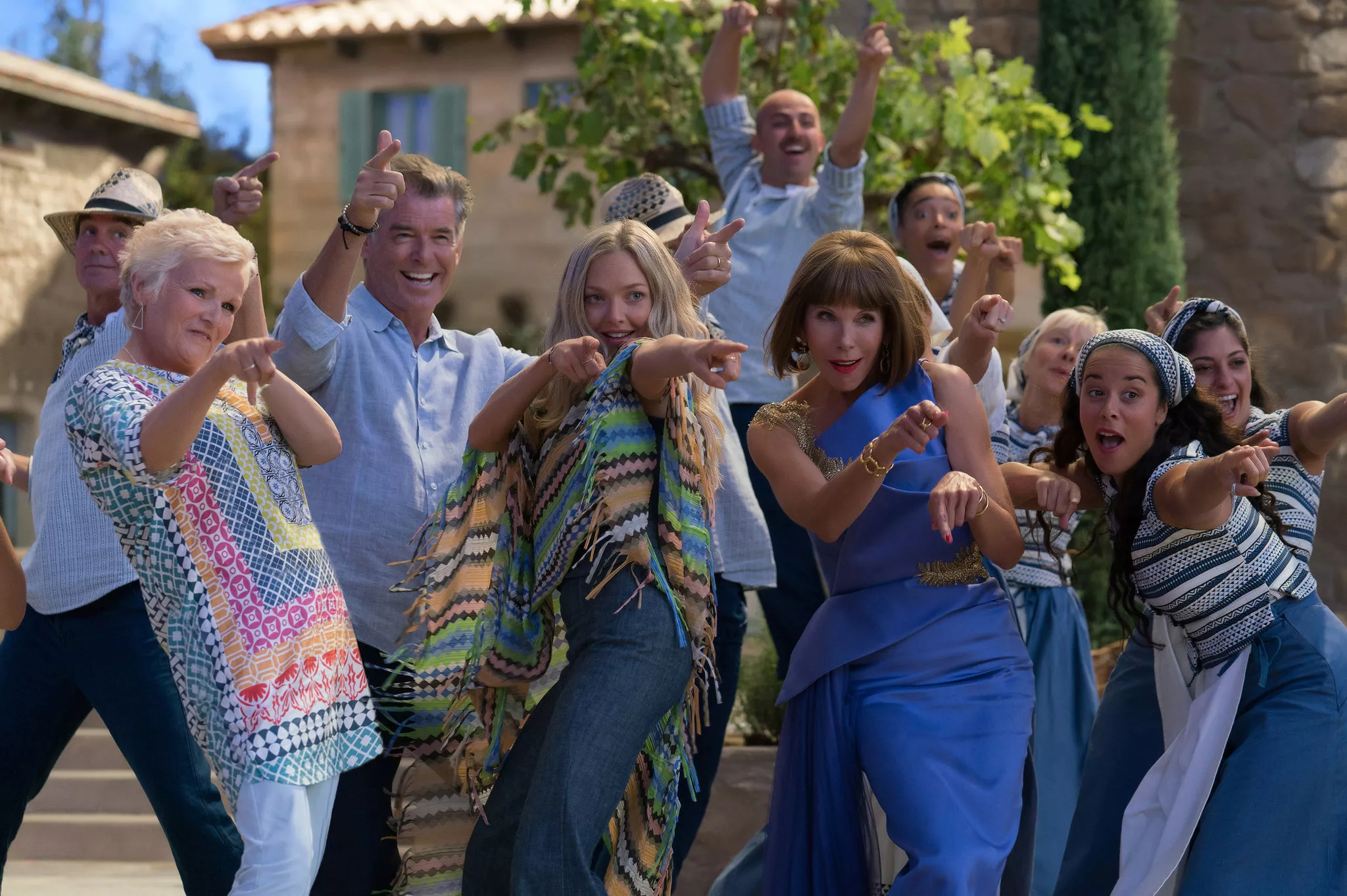 Julie Walters, Pierce Brosnan, Amanda Seyfried, and Christine Baranski pointing