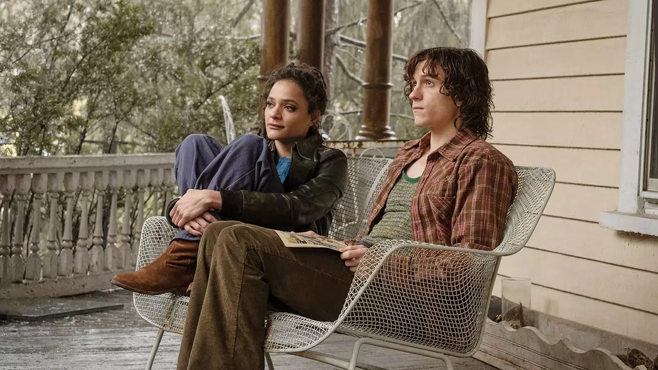 Danny, played by Tom Holland, and Ariana, played by Sasha Lane, sitting together