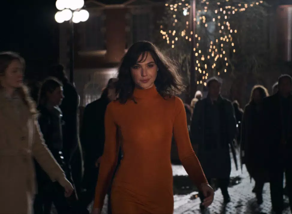 Gal Gadot looking beautiful as she struts down the street.