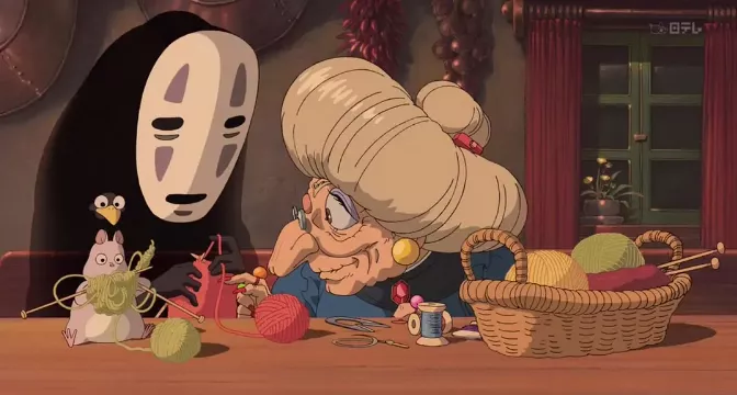 Zeniba instructing No-face on handcrafting.