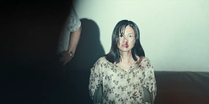 (Still of the female spy in captivity)