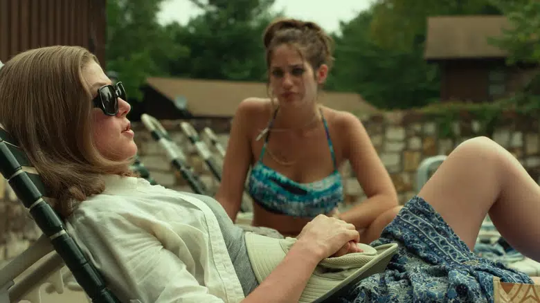 Amy and Neighbour talking by the pool 