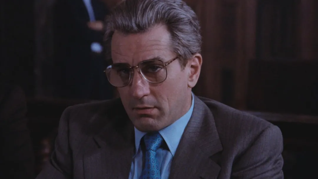 Robert De Niro wearing glasses as Jimmy Conway