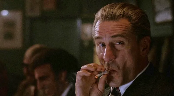Jimmy Conway smokes a cigarette
