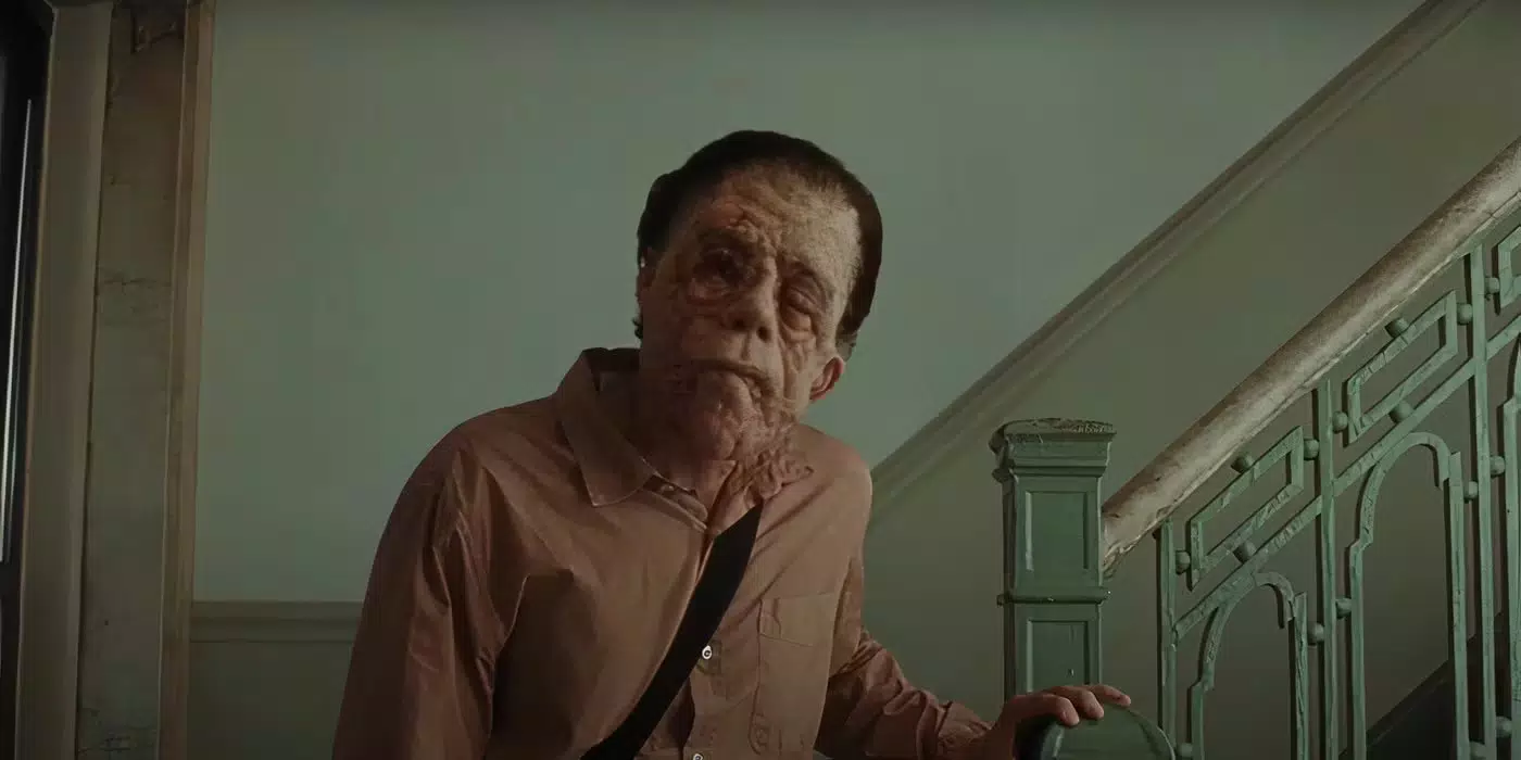 Edward in A Different Man. He looks directly at the camera.