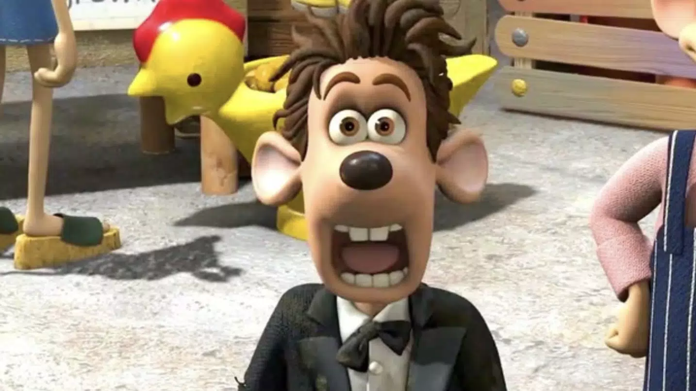 An animated rat in a suit looks surprised