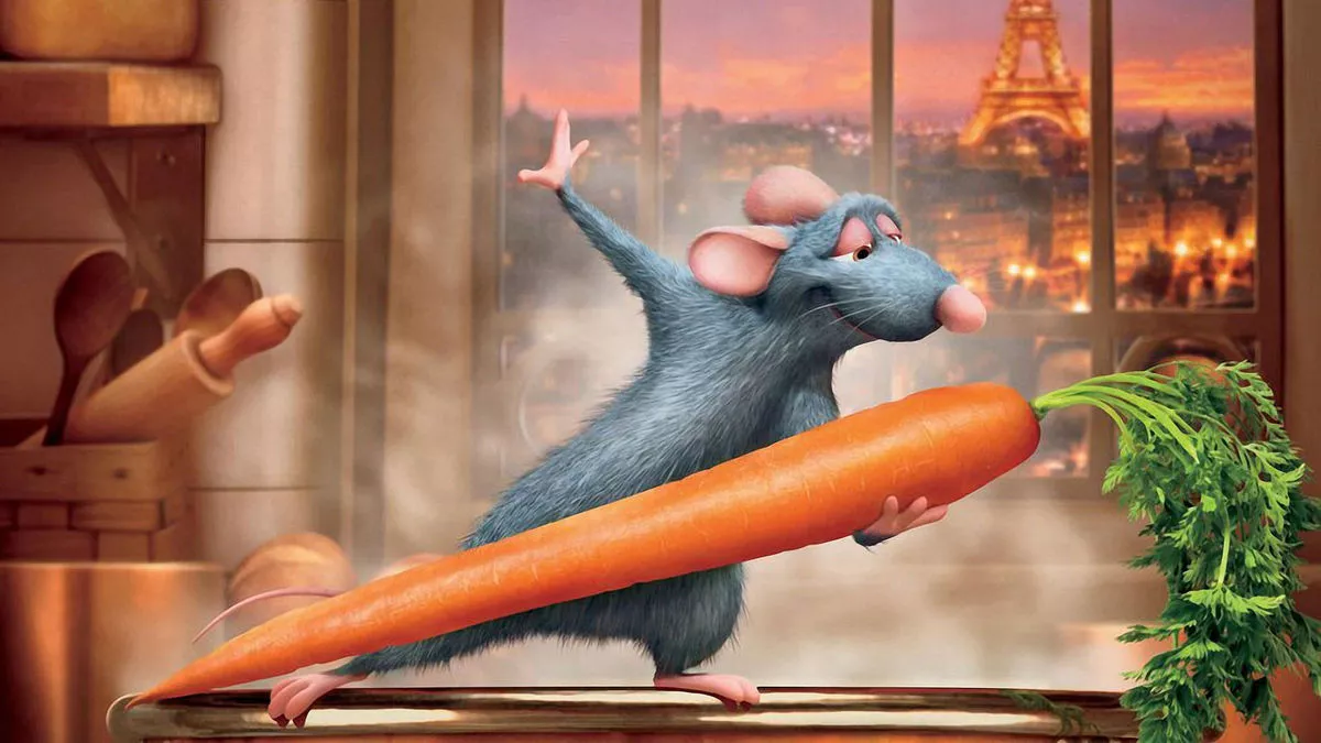 An animated rat dancing with a large carrot