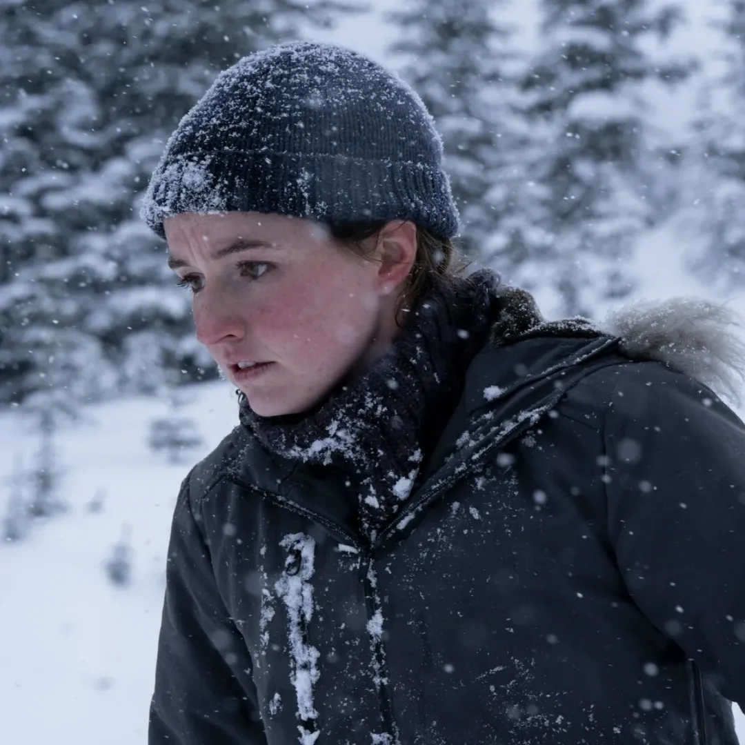 A woman in a snowy forest