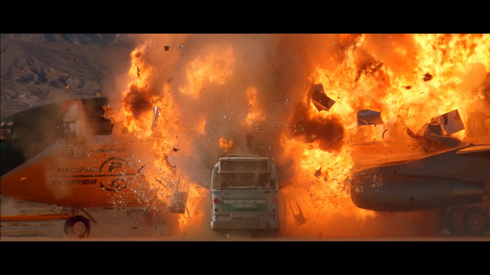 a bus and plane exploding