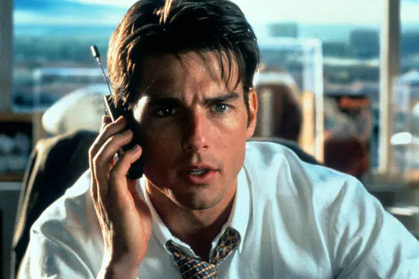 Tom Cruise talks on a phone in a scene from the film 'Jerry Maguire', 1996.