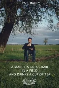 A Man Sits On A Chair In A Field And Drinks A Cup Of Tea_peliplat